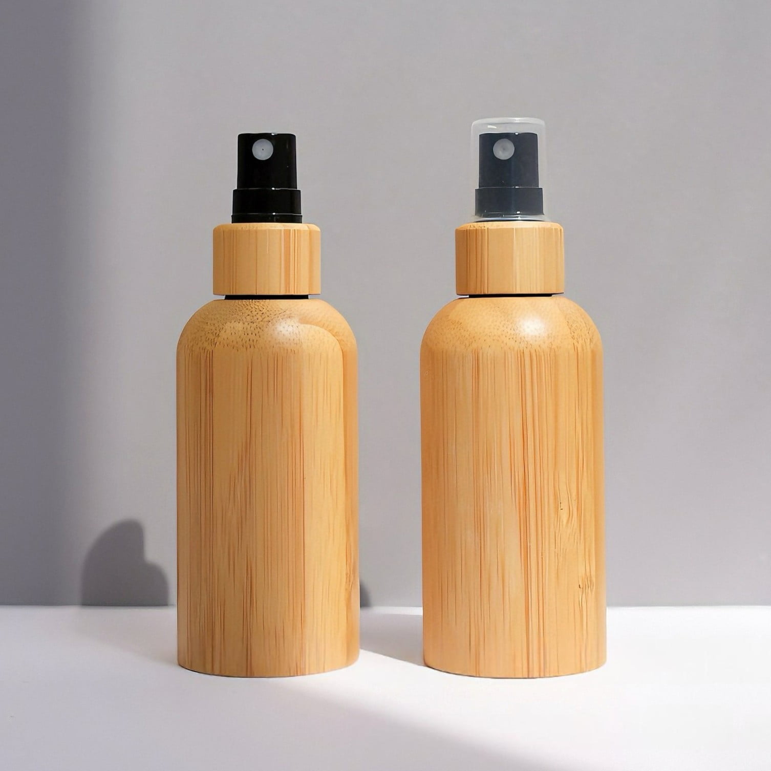 Bamboo cosmetic cap treated with eco-varnish showing water droplets sliding off due to the lotus effect