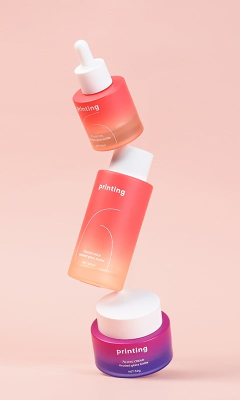 Aurora gradient spray coating on custom skincare bottles