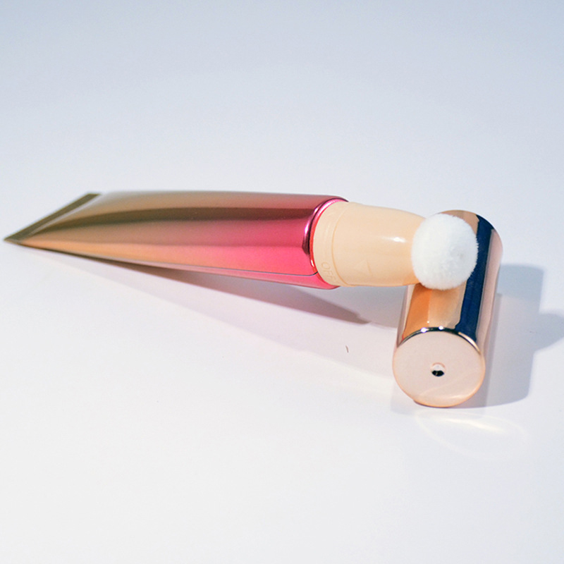 Chemical-resistant lip gloss packaging with flocked applicators