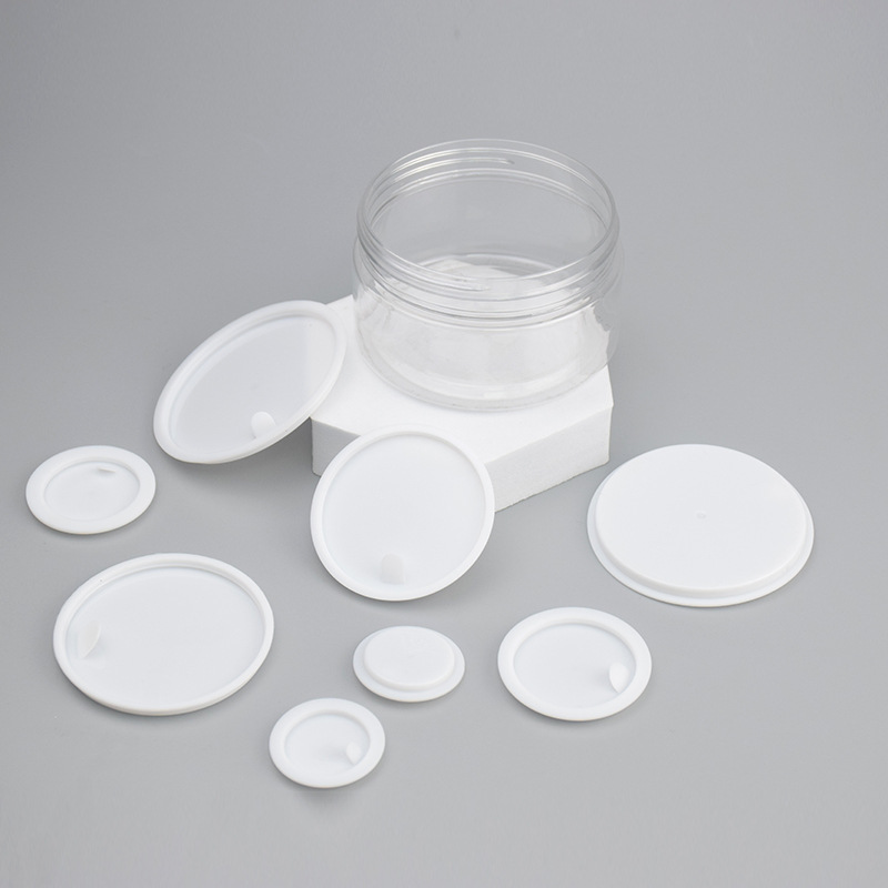 Cosmetic jar protective pull-tab inner lids