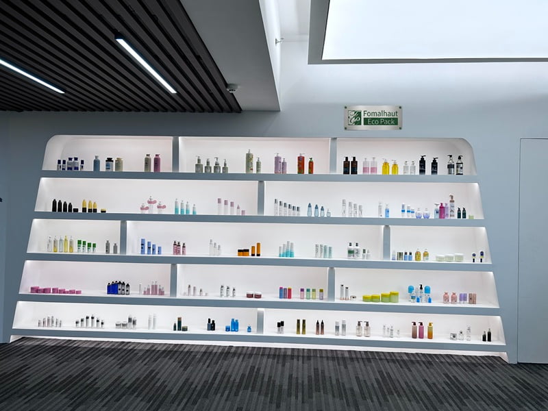 Modern cosmetic packaging manufacturing facility and quality control team