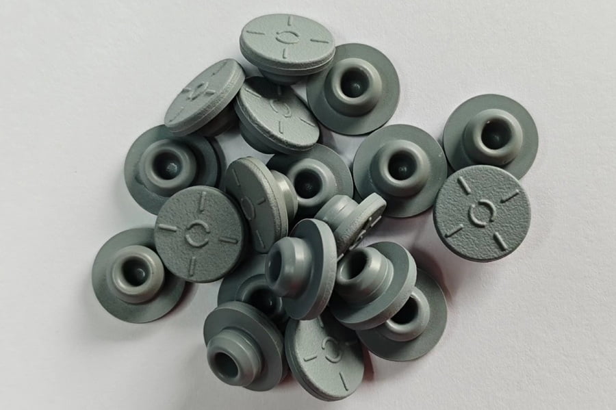 Grey halobutyl rubber stoppers coated with a thin transparent PTFE layer