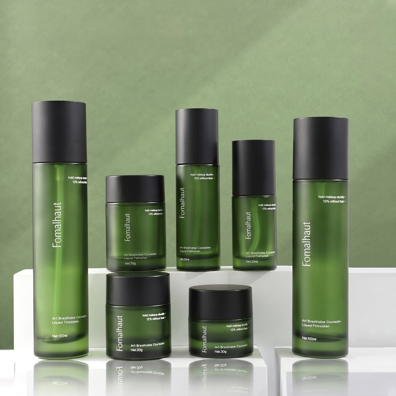 Heavy-wall transparent and frosted glass cosmetic bottles demonstrating minimalist elegance