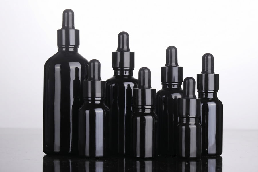 Violet glass cosmetic bottles and heavy-wall glass packaging