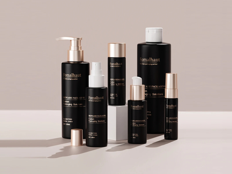 Assorted cosmetic bottles in different sizes with pump and disc-top closures