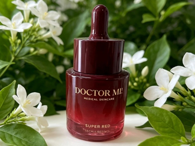 Burgundy cosmetic dropper bottle with gold hot stamped branding
