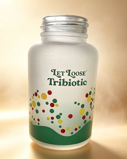 Frosted glass bottle with a colorful transferred pattern