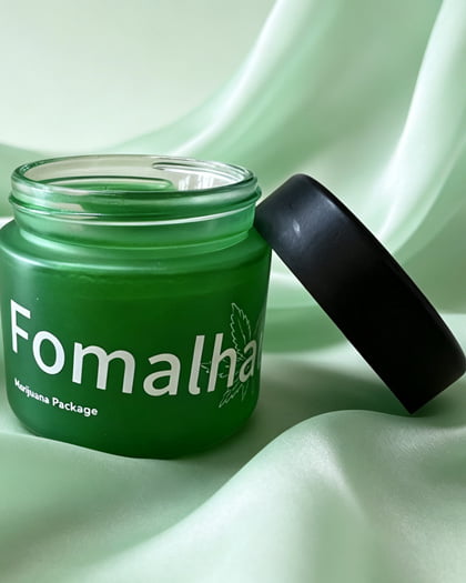Green glass cosmetic jar with spray coating and white silk screen printing