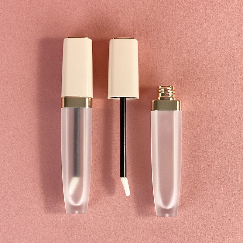 Frosted lip gloss tubes with cream-colored caps and a wand applicator